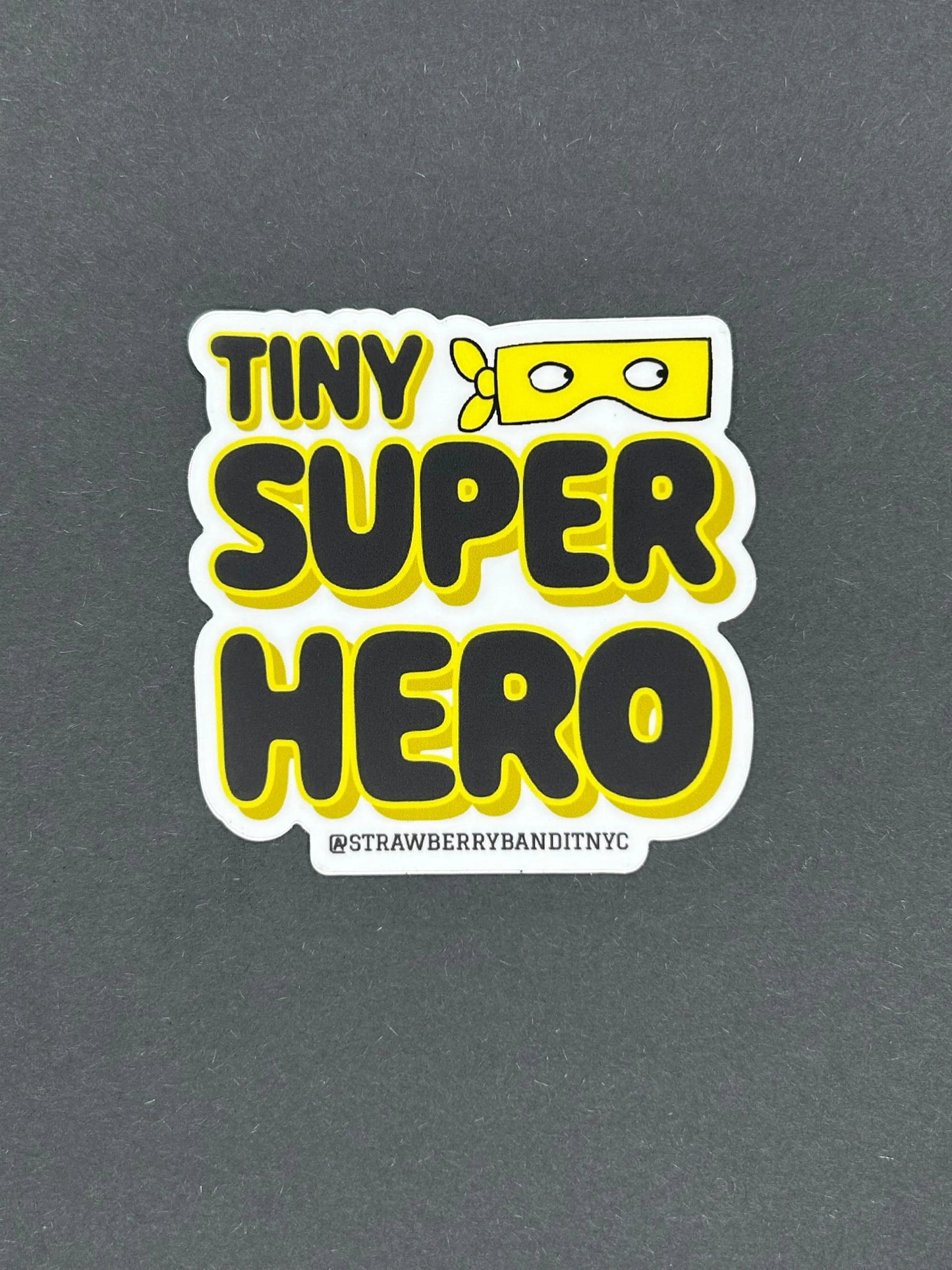 ‘TINY SUPERHERO’ Sticker Strawberry Bandit