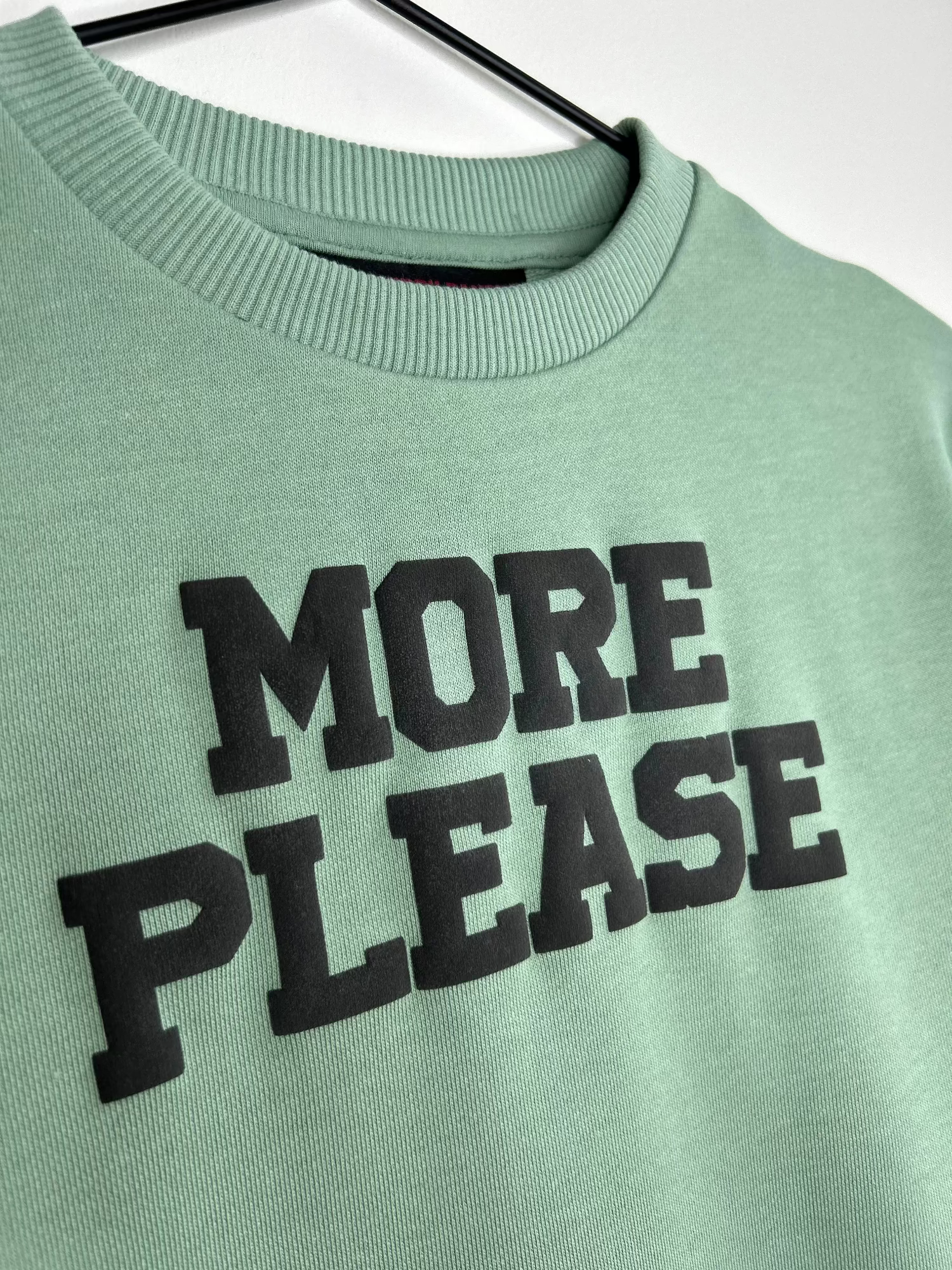 ‘MORE PLEASE’ Crewneck Strawberry Bandit Puff Graphic Green Crewneck.