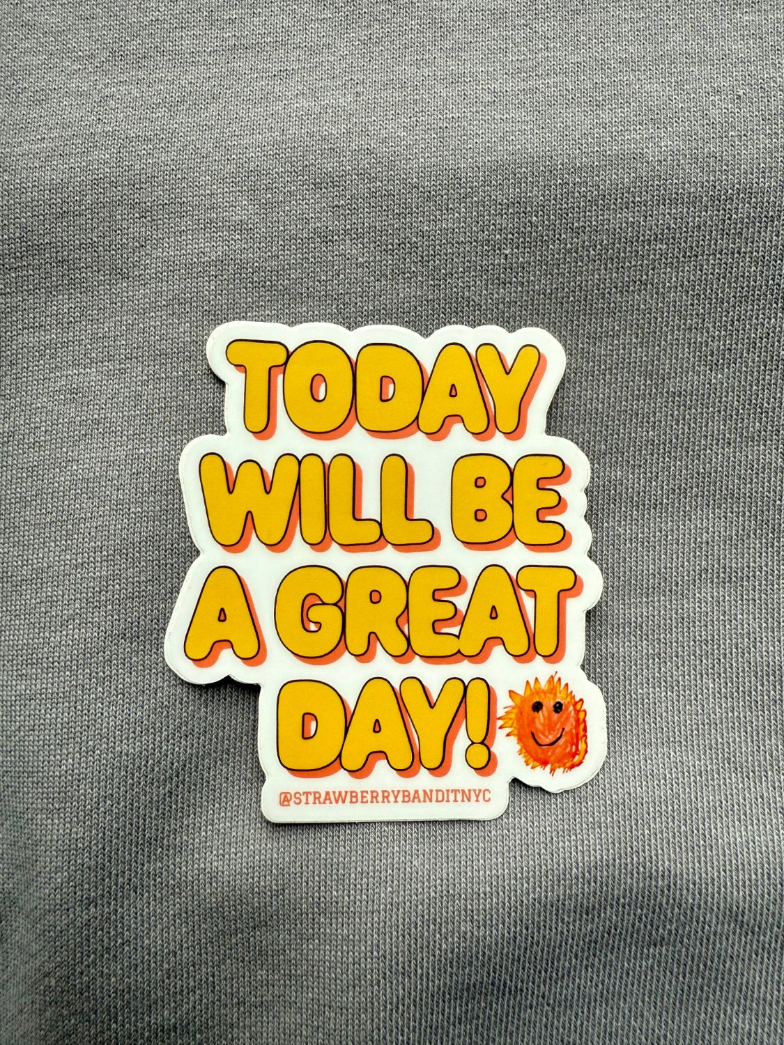 Strawberry Bandit "Today Will Be a Great Day" sticker with cheerful motivational message on clear background.