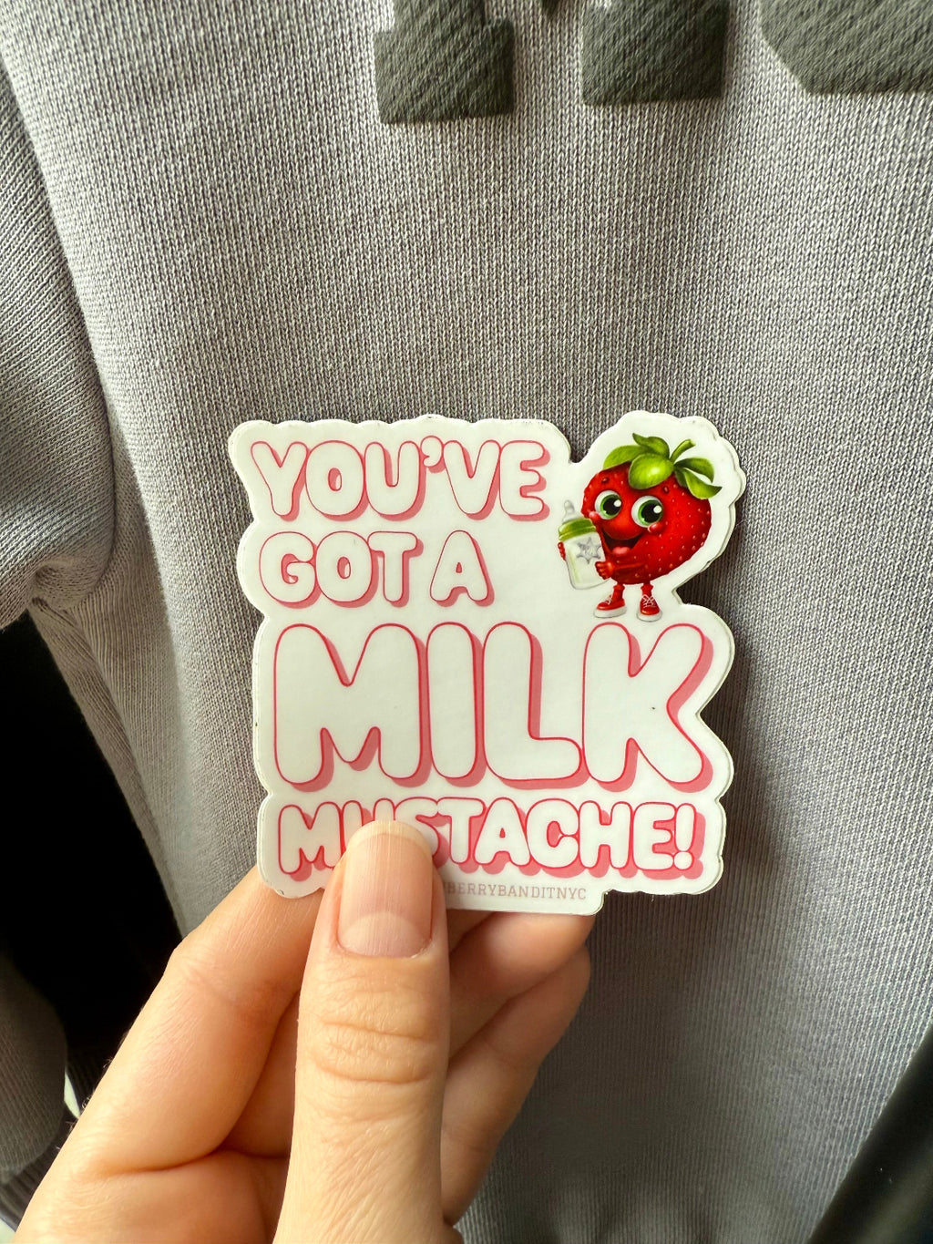 Strawberry Bandit "You've Got a Milk Mustache" sticker featuring a playful milk mustache design on a white background.