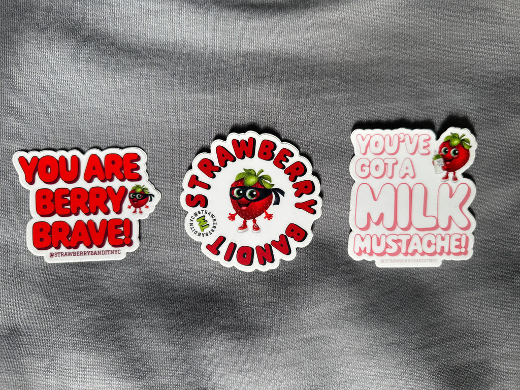 Colorful Strawberry Bandit sticker set with playful fruit and character designs on a white background.